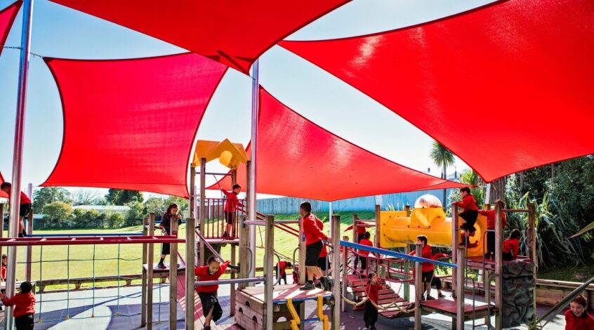 Triangle and square shade sails over playground by Sunnyside